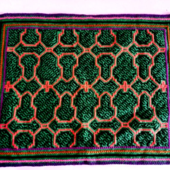 Hand embroidered shipibo altar design multicolored patterns Amazon jungle